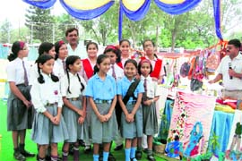 The winners of bag-making competition with Uttarakhand Agriculture Minister Trivendra Singh Rawat at an Earth Day function in Dehradun on Thursday.