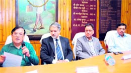 SCMC secretary Ghildyal addresses a gathering at a meeting