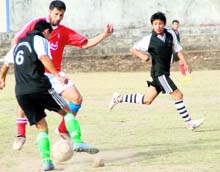 A match in the RB Singh Memorial Football Tournament being played in Dehradun on Thursday. A Tribune photograph