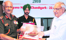 Chief Minister Bhupinder Singh Hooda presents a memento to the GOC-in-C, Western Command, Lt-Gen SR Ghosh, in Chandigrah on Thursday.