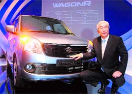 Shinzo Nakanishi, managing director and CEO of Maruti Suzuki India Limited, poses with new WagonR at its launch in New Delhi on Friday. 