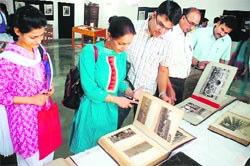 Visitors at an exhibition of manuscripts and rare photographs organised by the Department of Libraries and Research in collaboration with the Department of Archives at Kala Kendra in Jammu