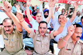 Customs officials raise slogans during a protest against the Finance Ministry and the Centre over their demands in Amritsar