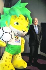 FIFA president Sepp Blatter poses beside the official 2010 World Cup mascot Zakumi after a news conference in Zurich