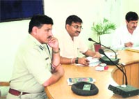 Mela Officer Anand Vardhan, with Mela DIG Alok Sharma, at the Kumbh nodal officers meeting at CCR Tower in Haridwar