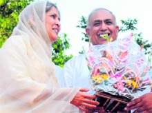 Harjinder Kaur congratulates Ravinder Krishan on being re-elected president of the local unit of the RJD in Chandigarh on Sunday. Tribune photo: Pradeep Tewari