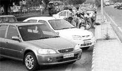 Vehicles parked on the main road at the subzi mandi in Phase 7 of Mohali. 