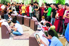 Tibetans participate in a painting competition on the 21st birthday of the Panchen Lama at McLeodganj, near Dharamsala, on Sunday. Photo: Kamaljeet