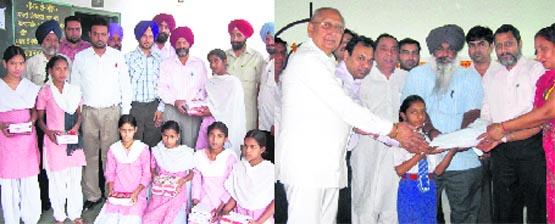 Education minister (OSD) Roshan Lal distributes exercise books to students at Government Middle School, Sounti; and (right) books being given to the needy student