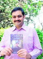 IPS officer Vineet Agarwal with his novel Romance of a Naxalite. 