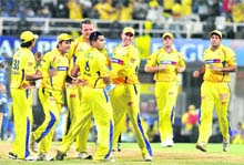 Chennai Super Kings celebrate a wicket in Mumbai on Sunday. 