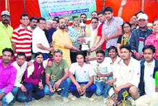 Members of the Haldwani Colt team with their trophies.