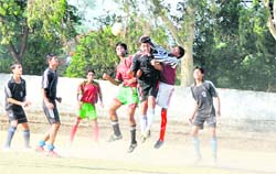 A match of the RB Singh Memorial Football Tournament being played in Dehradun on Monday.