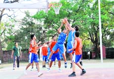The final of the District Inter-school Junior Basketball Tournament in progress in Dehradun on Monday. 