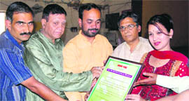 Sangeeta Dhaundiyal being honoured at a function held at MKP Inter College in Dehradun on Monday.