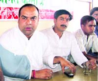 Manmohan Katoch, state Youth Congress president, addressing a press conference at Dharamsala on Monday.