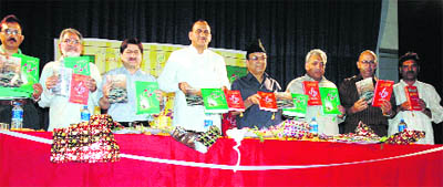 Finance Minister Abdul Rahim Rather (fourth from right) and R&B Minister GM Saroori (fifth from right) release books of Aseer Kishtwari (third from right) in Jammu on Sunday night.