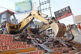 JCB machines of the Municipal Corporation remove encroachments during a drive in Amritsar