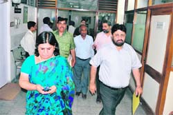 Mayor Anu Chatrath, former Mayor Pradeep Chhabra and other councillors walk out of the F&CC meeting in Chandigarh on Tuesday.