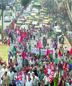 Activists of 13 opposition parties block road at Daryaganj in Delhi on Tuesday.