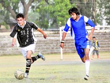 A match of the RB Singh Memorial Football Tournament being played at Pavillion Grounds in Dehradun on Tuesday. A Tribune photograph