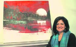 Punam Gupta with one of her paintings.