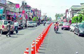 Vehicles move with ease with the putting up of bollards at Gandhi Nagar Market in Jammu. Tribune photo: Anand Sharma