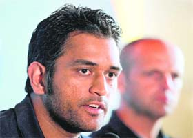 Indian cricket captain Mahendra Singh Dhoni and coach Gary Kirsten during a press conference in Mumbai