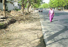 Road widening in Sector 10 has forced residents to walk on the road instead of pavements; a woman walks in the middle of the road separating Sectors 46 and 37 as pavements have been removed from both sides; and pavements are missing from a road in Sector 22, Chandigarh.