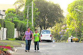 Road widening in Sector 10 has forced residents to walk on the road instead of pavements; a woman walks in the middle of the road separating Sectors 46 and 37 as pavements have been removed from both sides; and pavements are missing from a road in Sector 22, Chandigarh.