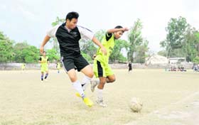 Players in action during a match at the Golden Jubilee Basketball Tournament in Dehradun