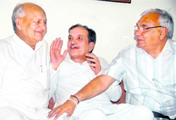 CM Bhupinder Singh Hooda with Congress state chief Phool Chand Mullana and Birender Singh at a meeting in Chandigarh 