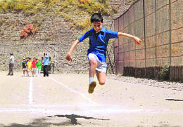 A boy participating in a sports competition at St. Edwards School in Shimla on Wednesday.