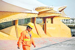 A worker walks past the Norway pavilion at the site of the World Expo 2010 in Shanghai on Thursday. Shanghai opens the World Expo on May 1, with 189 countries taking part in the massive six-month showcase of ideas and technology  the latest display of China's growing global clout. 