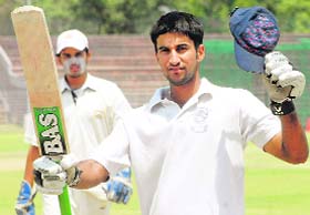 Amit Prashar celebrates after hitting a century against Ropar in Chandigarh