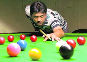 Amit Verma aims a shot during the 26th Chandigarh (UT) Billiards and Snooker Championship
