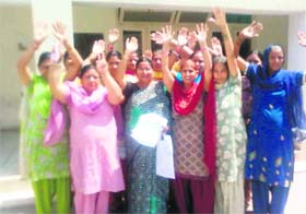 Women of ward no 3 protest against poor water supply in front of the MC office in Dera Bassi