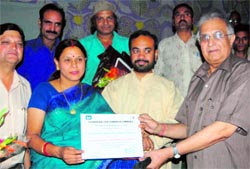 Asha Saklani, producer of documentary film Amar Shaheed Sridev Suman, being honoured in Dehradun on Thursday. A Tribune photograph