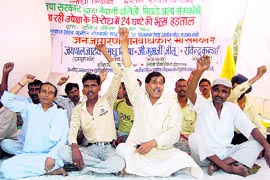 Workers of the Dalit Shoshit Vikas Manch hold a dharna in Dehradun on Thursday. A Tribune photograph