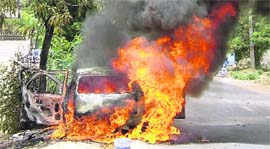 A car catches fire in Sector 46 of Gurgaon on Thursday.