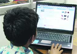 A 10-year-old boy accesses his Orkut account.