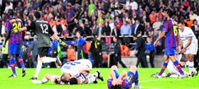 Inter Milan's players celebrate after beating Barcelona in the UEFA Champions League semifinal on Wednesday.  AFP