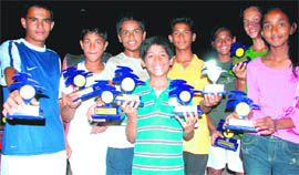 Winners with their trophies during the Manav Mangal Total Tennis AITA Talent Series Tournament in Mohali on Friday.