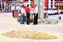 The garbage heap covered with lime and flowers next to the venue of the Cabinet meeting in Haridwar on Friday.