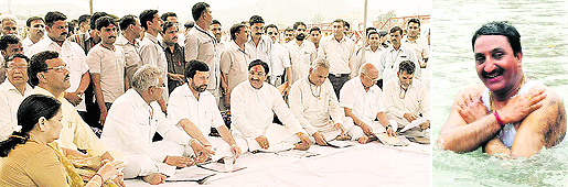 Uttarakhand Chief Minister Ramesh Pokhriyal Nishank (right) taking a dip in the Ganga before holding a meeting of his council of ministers on the banks of the river at Haridwar on Friday. 