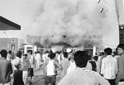 Smoke billows from the office of a petrol station after a fire broke out in Ambala on Saturday.