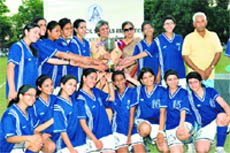  The Welham Girls Hockey team receives the trophy after winning the Inter-Council School Junior Girls Hockey Tournament in Dehradun on Saturday. A Tribune photograph  