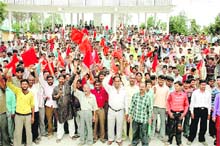 Construction workers hold a demonstration on May Day in Pitthoragarh.