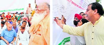 Congress leaders at the launch of a signature campaign against the state BJP government in Haridwar (left) and Dehradun on Saturday.