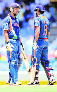 Murali Vijay (R) and Yuvraj Singh at the Beausejour Cricket Ground in Gros Islet, St Lucia on Saturday.